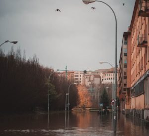 Flooded street with brick buildings